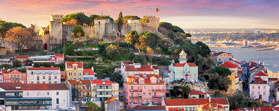 The Lisbon skyline featuring the Sao Jorge Castle at sunset