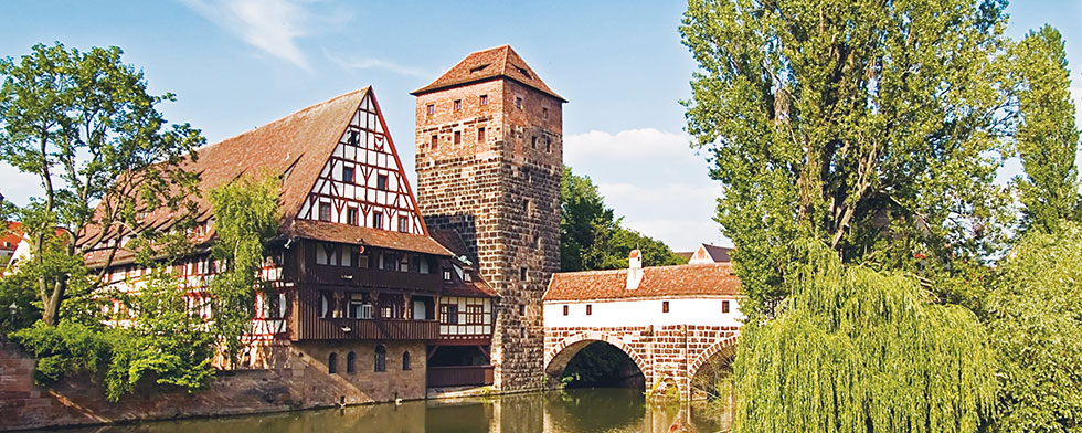 Bavarian-style building and brick bridge in Nuremberg, Germany